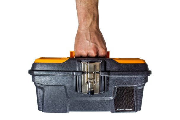 Ручна коробка інструментів ізольована на білому, працівник несе коробку інструментів або органайзер з металевою засувкою
 - Фото, зображення