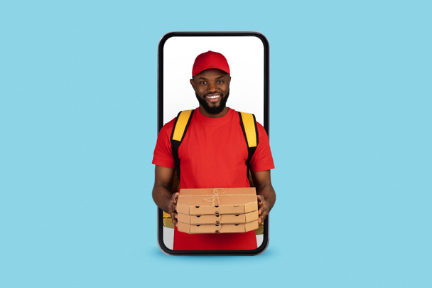 Food Delivery App. Black Courier Guy With Pizza Looking Out Of Smartphone - Photo, Image