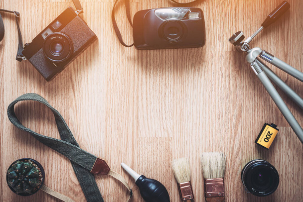 Top View of Vintage Camera and Film Photography Accessories Flat Lay Style on Wooden Background - Φωτογραφία, εικόνα