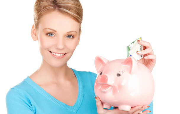 Lovely woman with piggy bank and money - Foto, imagen