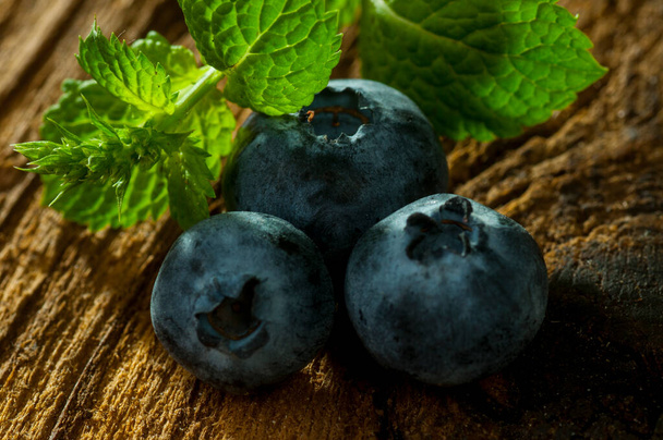 blueberry close up on wooden background - 写真・画像