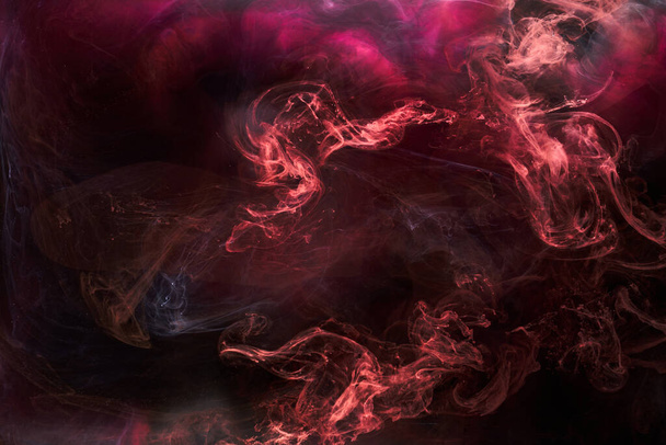 Black and red ink background, colorful fog, abstract swirling ocean, acrylic paint pigment underwater, white smoke - 写真・画像