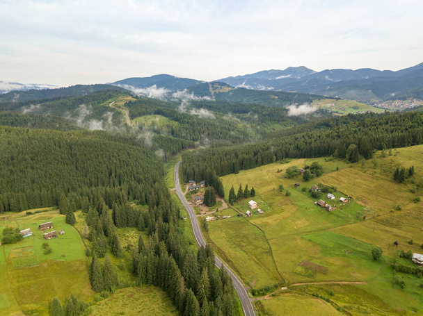 Green mountains of Ukrainian Carpathians in summer. Aerial drone view. - Photo, image
