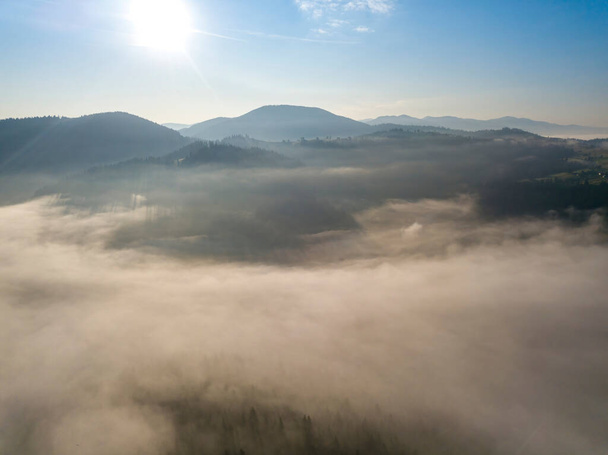 Morning fog in the Ukrainian Carpathians. Aerial drone view. - Photo, Image