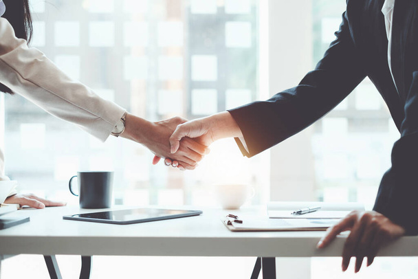Business partnership meeting concept. Image business women handshake. Successful business people handshaking after good deal. Group support concept. - Foto, Imagem