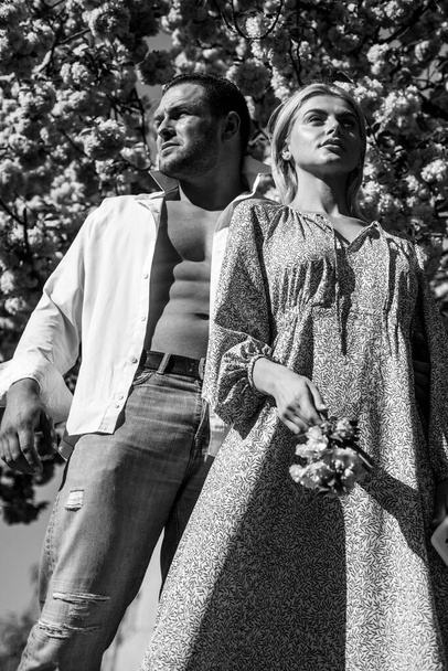 Spring fashion people. Romantic portrait of a sensual couple in love. Beautiful young couple in love outdoors. - Photo, image