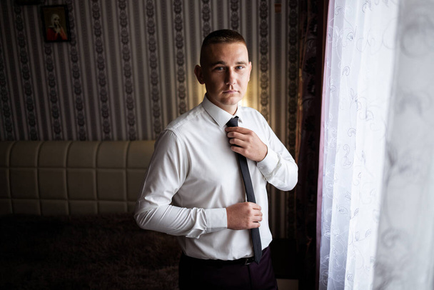 Portrait of a young male businessman. Groom on the wedding day. Wearing a business suit for an important interview. - Фото, зображення