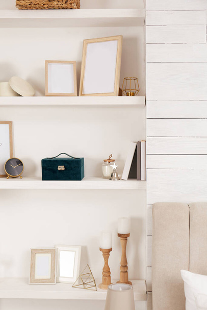 Wall shelves with beautiful decor elements indoors. Interior design - Fotografie, Obrázek