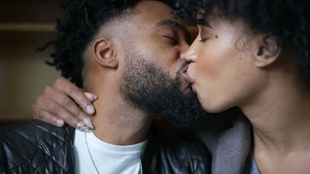 Passionate kiss a black couple kissing an African man and woman love - Фото, изображение