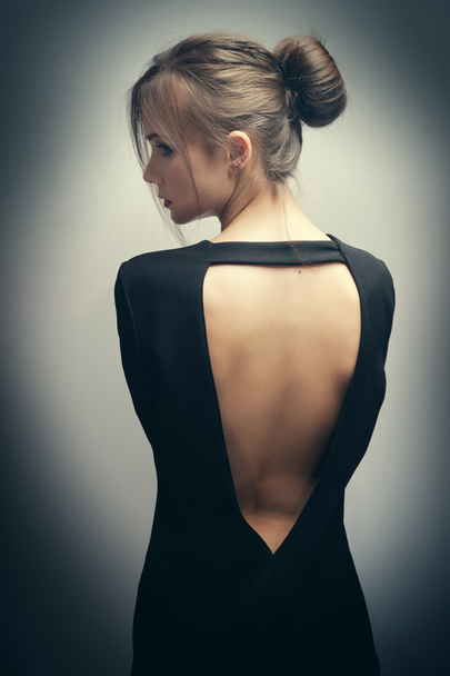Portrait of beautiful brunette woman in black dress. Cosmetic Eyeshadows. Fashion photo - Zdjęcie, obraz