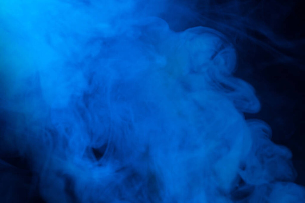 Blue steam on a black background. Copy space. - Foto, Bild