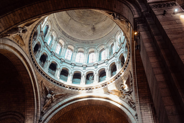 PARIS, FRANCE, 08.03.2022. Basilica Sacr-Coeur church inside, incredible beauty place in Paris. Very beautiful falling light - Photo, Image
