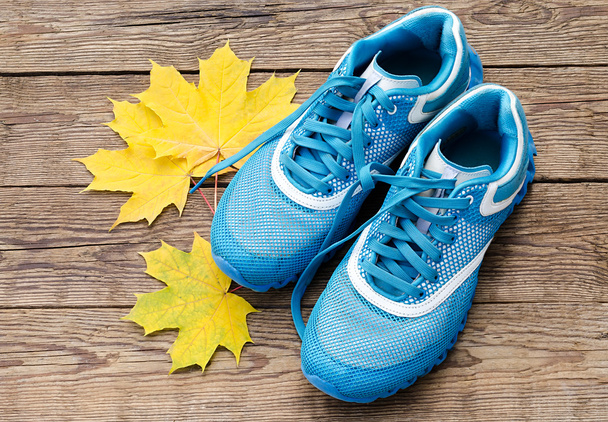 sneakers and yellow leaves - Photo, Image