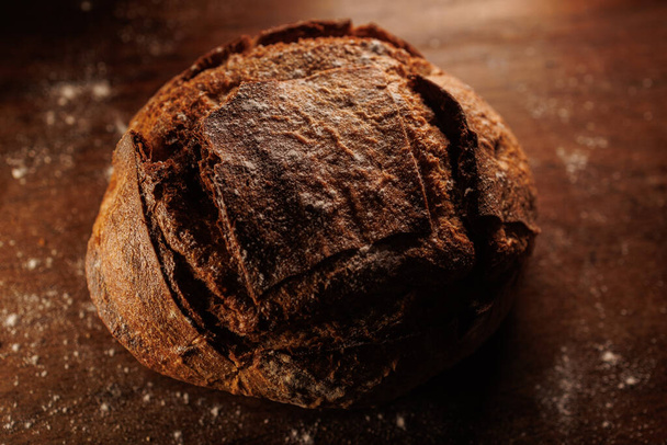 rye bread on a dark background - Фото, изображение