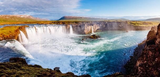 Nice views of the bright sunlit powerful Godafoss cascade. Popular tourist attraction. Unusual and picturesque scene. Location Bardardalur valley, Skjalfandafljot river, Iceland, Europe. Beauty world. - Photo, Image