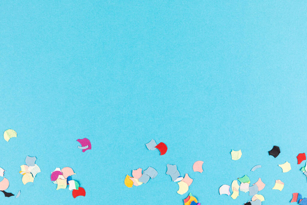 colorful confetti on blue background - Foto, imagen