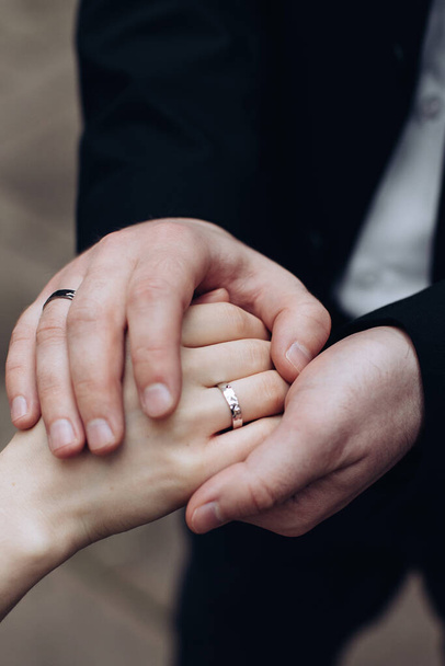 The groom puts a wedding ring on the bride's finger. Wedding ceremony. The concept of love - Φωτογραφία, εικόνα