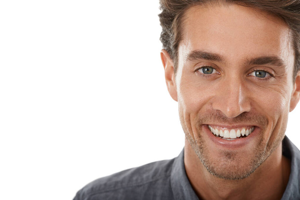 Hes so charismatic. Portrait of a handsome young man smiling against a white background. - Photo, Image