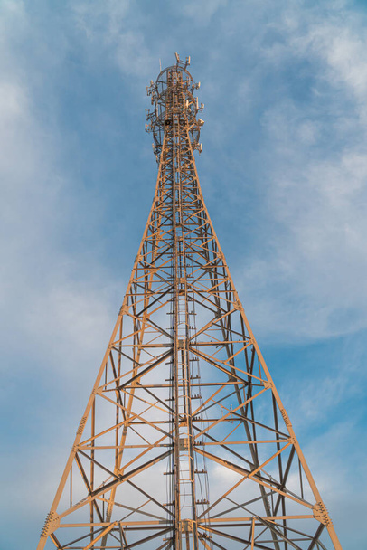 telecommunication tower with antennas and blue sky - Fotoğraf, Görsel