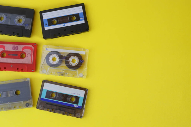 Retro audio cassette tape from the 80s and 90s on a yellow background. - Fotografie, Obrázek