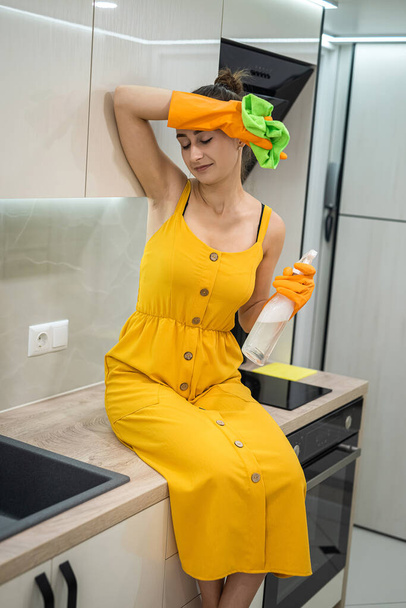 Pretty housewife doing chores at home, clean and disinfection concept - Photo, Image