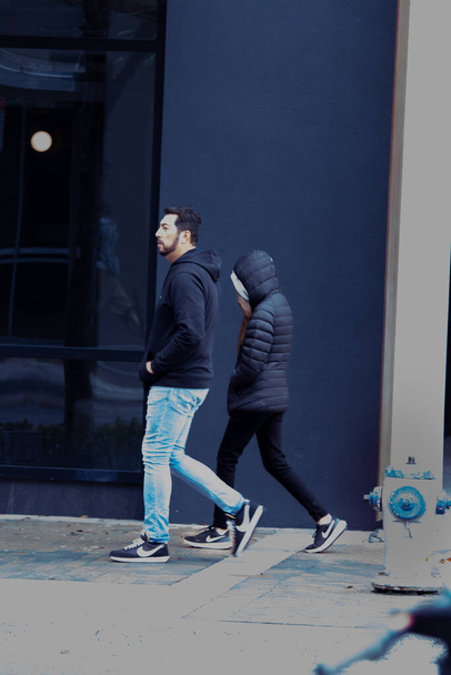 young couple in the city walking - 写真・画像