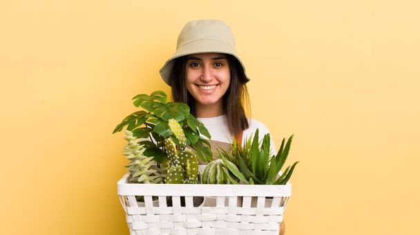 young hispanic woman with plants. gardering concept - Foto, imagen