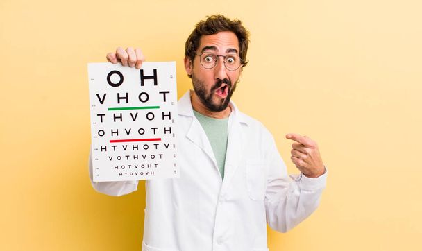 young specialist with a optical vision test - Fotoğraf, Görsel