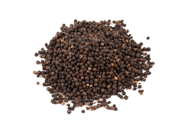 Black pepper was placed on a white background - Photo, image