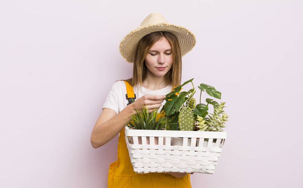 pretty caucasic woman with plants. gardering concept - Foto, afbeelding