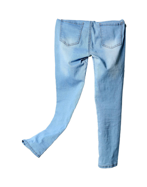 Jeans skinny volanti su sfondo bianco, vista posteriore - Foto, immagini