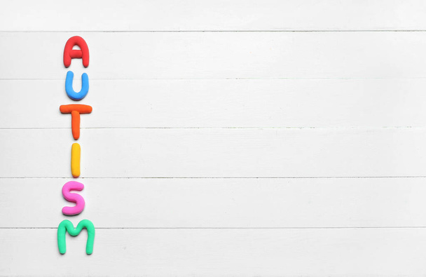 Word AUTISM on white wooden background - Photo, Image