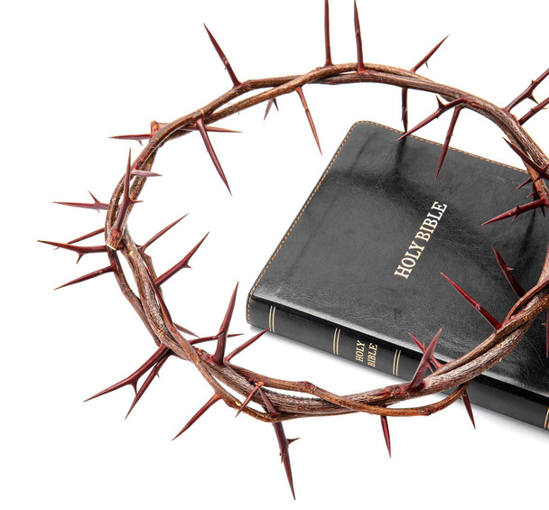 Crown of thorns with Holy Bible on white background - Photo, Image