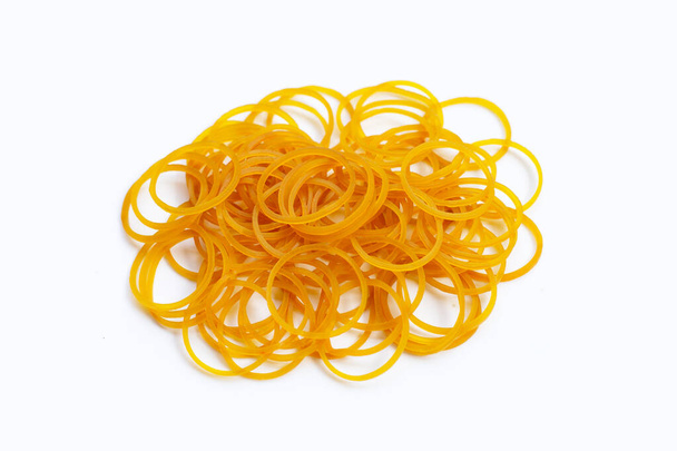 Yellow rubber band  on white background. - Photo, Image