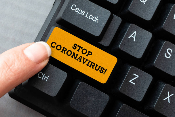 Bildunterschrift: Stop Coronavirus. Konzept der Kampagne zur Sensibilisierung für Krankheiten zur Verringerung der COVID19-Fälle Typisierung einer neuen Ausgabe des Informations-E-Books, Erstellung frischer Website-Inhalte - Foto, Bild