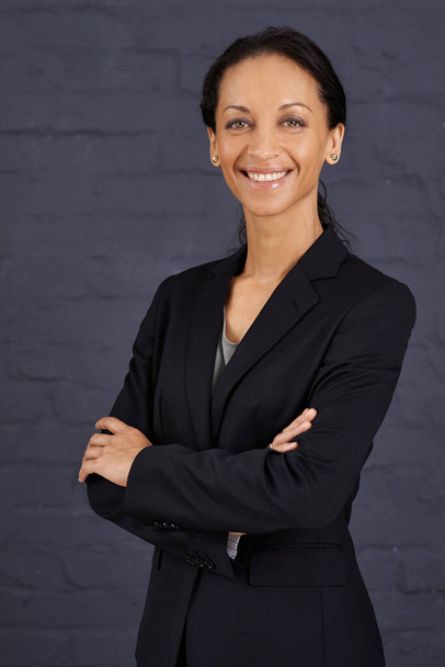 Shes the best in the business. Portrait of a confident businesswoman standing with her arms crossed. - Photo, image