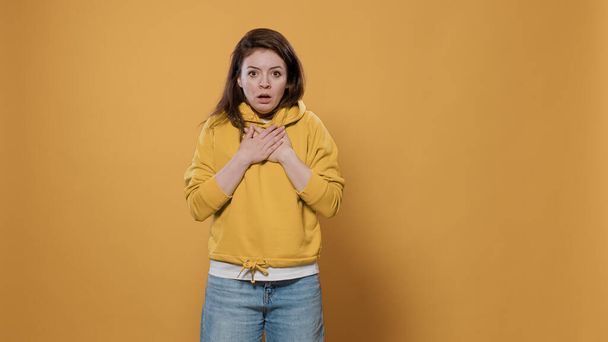 Woman having panic attack feeling short of breath getting scared and anxious - Photo, Image