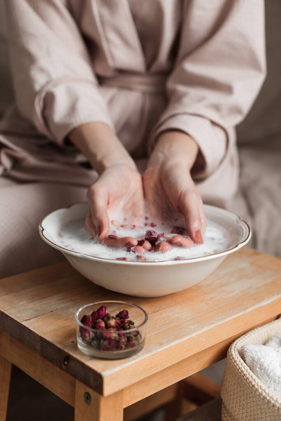 woman with a bowl of fresh strawberries and red currant - 写真・画像