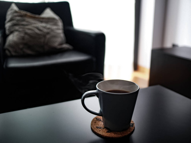 cup of coffee and sofa at home - Photo, Image
