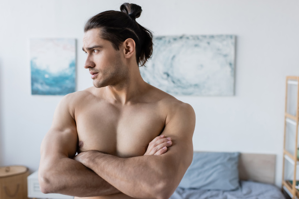 Muscular Man With Long Hair Standing With Free Stock Photo and Image