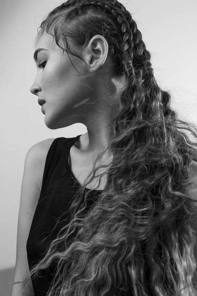 Beautiful portrait of a girl with an art hairstyle - 写真・画像