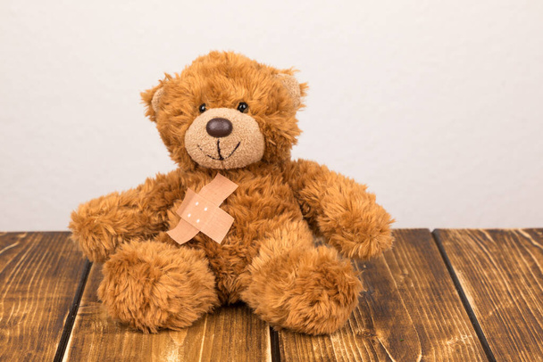 teddy bear with toy on wooden background - Foto, Imagen