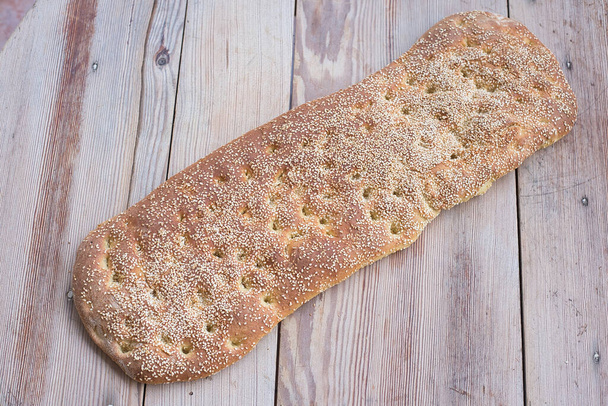 fresh bread on wooden background - Фото, изображение