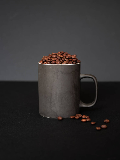 coffee beans in a cup on a black background - Foto, Imagem