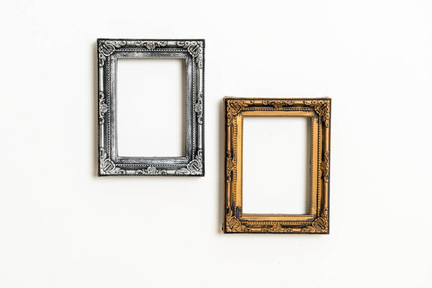 empty picture frame on white wall background with copy space - Фото, изображение