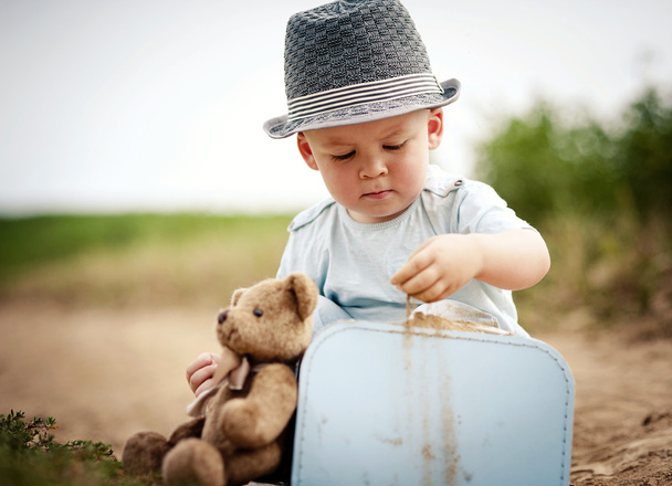 Little boy playing with teddy bear - Fotoğraf, Görsel