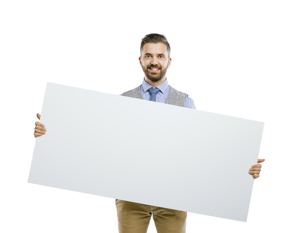 Businessman holding blank advertisement - Foto, afbeelding