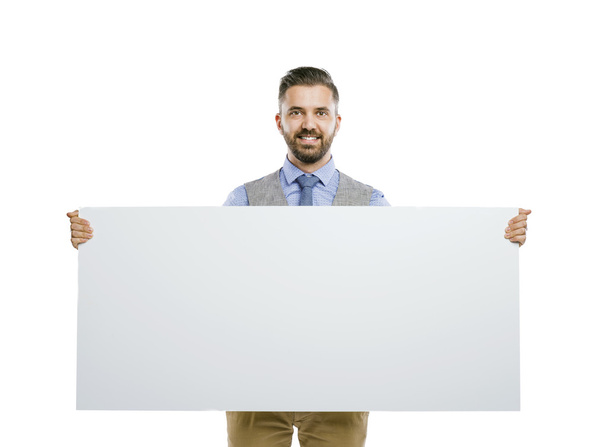 Businessman holding blank advertisement - Fotó, kép