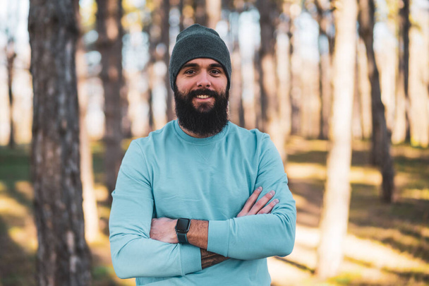 Portrait of sporty man with beard  in nature. - Photo, image