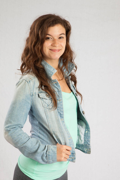 Lovely woman in a jean jacket and a smile - Photo, Image